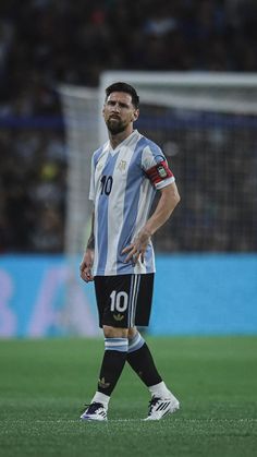 a man standing on top of a soccer field