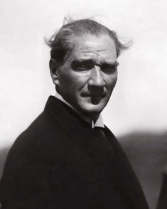 an old black and white photo of a man