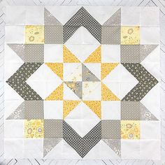 the block is made up of yellow and gray squares, which are arranged in different directions