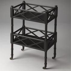 a three tiered shelf with wheels on the bottom and one section open to show it's contents