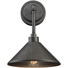 an industrial style light fixture with a black shade on the side and a white background