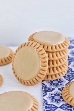 some cookies are sitting on a blue and white cloth