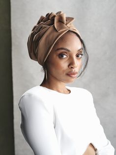 Ready to Wear Turban Cap This French Twist Turban is made fabric that is stretchy, light, and comfortable with a soft neutral undertone that compliments all skin tones. This turban is designed to be worn ‘as is’! The back of the turban is secured with gathered pleated fabric details adding flattering volume and providing comfort and stability. Each turban was designed with comfort, style, and wearability in mind. Surturbans are designed to be worn easily- there's absolutely no tying or closing i One Size Beige Bonnet, Beige One Size Fits Most Bonnet, One Size Fits Most Beige Bonnet, Chic Adjustable Turban Headband, Adjustable Cream Headwrap, Adjustable Beige Headscarf, Turban Outfit, Tie A Turban, Chemo Scarves