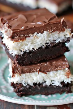 three pieces of cake sitting on top of a blue and white plate next to each other