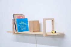 a book shelf with two books on it