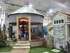 people are standing in the doorway of a shed