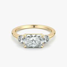 three stone diamond ring in yellow gold