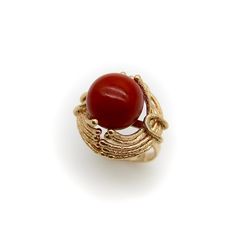 This is part of Chairish’s Fine Jewelry assortment.  At Kirsten’s Corner we love vintage coral, and this ring centers around a 12mm round sphere of well-saturated deep red Sardinian coral. The ball is centered in a tentacle-like circular mount that flows from its base and grasps the coral ball in a beautiful sci-fi fashion.  The 14k gold tentacles have a textured matte surface, ending in tiny golden balls that come together on either side of the sphere like finger tips on a hand. Circa the 1970’ Elegant Red Dome Ring For Formal Occasions, Elegant Red Dome Ring For Anniversary, Elegant Coral Ring Jewelry, Classic Round Coral Jewelry, Classic Coral Round Jewelry, Formal Red Dome Ring, Elegant 14k Gold Rings With Round Beads, Sphere Jewelry, Sci Fi Jewelry