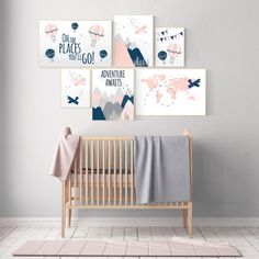 a baby's room with two posters on the wall and a crib next to it