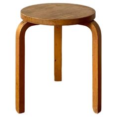 a small wooden table sitting on top of a white background