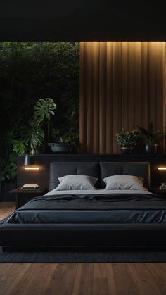 a large bed sitting in the middle of a bedroom next to a plant filled wall