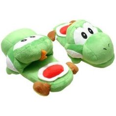 there are two green slippers with faces on them, one is for the same person