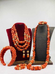 Handcrafted African Coral Beads Necklace - Unique Ethnic Jewelry for a Statement Look NEED OTHER DESIGNS OF BRIDE AND GROOM CORAL BEADS, AFRICAN PRE-TIED HEADWRAPS, BRAIDED WIGS AND AFRICAN GIFT ITEMS, VISIT OUR SHOP HERE: https://sereneafrica.etsy.com/ Materials: 1. Natural/Original African Coral bead 2. Gold color accessories  Features  This listing contains: 1. 3 layers of necklace, 2 bracelets, a set of dangling earrings and 1 broken coral beads head band for bride/woman. 2. 1 piece of neckl Elegant Orange Beads For Wedding, Elegant Orange Wedding Beads, Brides Accessories, Coral Accessories, Rich Gifts, African Wedding Jewelry, Black Dessert, Nigerian Beads, Wedding Coral