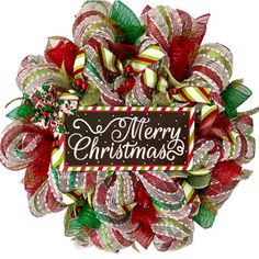 a christmas wreath with the words merry christmas on it and candy canes around it