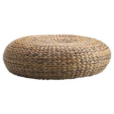 a round ottoman made out of straw with an oval design on the top and bottom