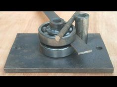 a metal object on top of a wooden table