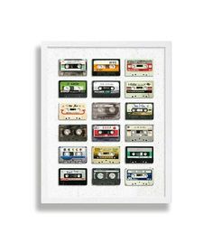 a white framed poster with cassette tapes on the front and bottom, all in different colors