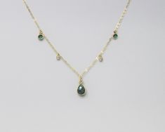 Please Note:  Our processing time is now 1 - 2 weeks before shipping.  We can no longer guarantee delivery by December 24th Emerald Necklace, May Birthstone, Birthday Gift for Daughter, Mother, Grandma, Real Emerald Teardrop Charm, Dainty Gold Filled Chain This genuine teardrop emerald is centered on a 14K gold filled chain.  It is accented with 2 tiny cz charms and for added interest we have added two green cz's to complete the look. IT'S IN THE DETAILS ✦ Shown at 18" ✦ 14K Gold Filled Chain ✦ Birthday Gift For Daughter, Daughter Mother, December 24th, May Birthstone, Emerald Necklace, Gift For Daughter, Emerald Gemstone, Support Handmade, Keep Jewelry