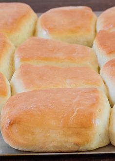 several loaves of bread sitting on top of a pan