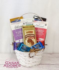 a white basket filled with assorted snacks