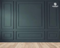 an empty room with dark green walls and wooden floors