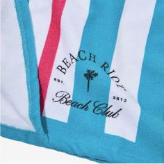 the beach boys logo is shown on this blue and white striped swimsuit with pink trims