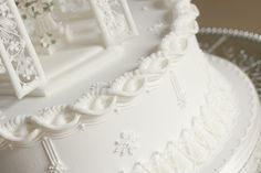 there is a wedding cake with white frosting