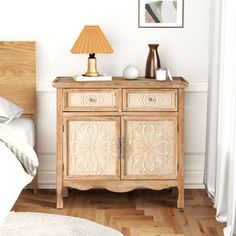 a bed room with a neatly made bed and a wooden dresser next to a window