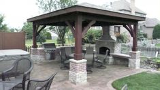 a gazebo with chairs and tables around it