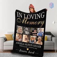 a woman holding up a blanket that says in loving memory with pictures of her family