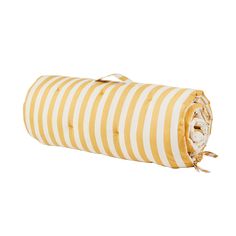 a yellow and white striped blanket folded on top of each other with a zippered closure