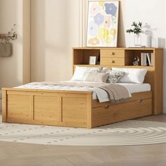 a bed with a book shelf above it in a room that has hardwood floors and white walls