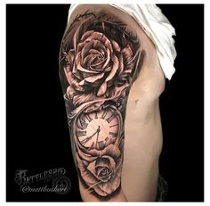 a man's arm with a rose and clock tattoo on the left side of his body