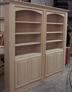 an unfinished bookcase in the process of being built