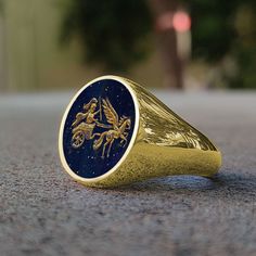 The ring stone in the photo is Lapis Lazuli. stone 16mm round This is an original engraved with intaglio Signet ring. Entirely handcrafted figure & letter ring. Machine not used.  The figure & letter was engraved by engraving pen without using any machine This is an original engraved with intaglio Signet ring.  Family Crast Base, Figures, Shapes, Clown, Fonts motif -----Product Details----- Stone engraving is the most difficult engraving known in the world. Each engraving is made individually by the artist with great effort, and each stone engraving is made after about 2 days of effort. That's why stone engravings are extremely special and unique. Gemstones of our products can be personalized as "Green Agate" "Red Agate" "Black Onyx" "Tiger's Eye". If you want to personalized gemstones wit Luxury Silver Intaglio Men's Ring, Stone Rings For Men, Engraving Pen, Engraved Pens, Family Rings, Stone Engraving, Signet Ring Men, Letter Ring, Signet Rings