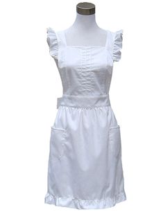 a white dress on a mannequin with ruffles and collared neckline