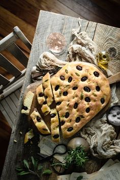 a table topped with lots of food on top of a wooden table next to a bottle of wine