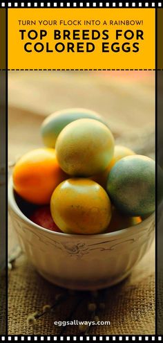 a bowl filled with different colored eggs on top of a table