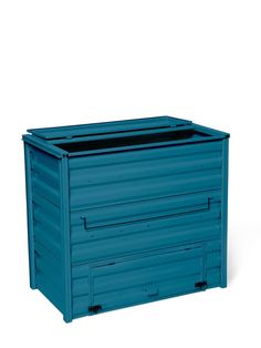 a large blue container sitting on top of a white floor