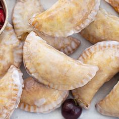 cranberry sauce in a bowl next to pastries