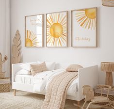 a bedroom with white walls and two paintings on the wall above the bed, along with a rocking chair