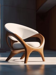 a white chair sitting on top of a floor next to a window