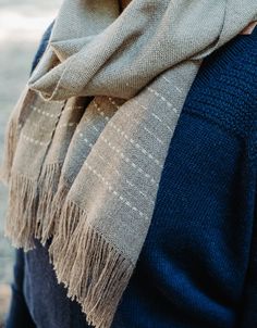 Light-weight Baby Alpaca scarf. Handwoven by artisans Puno, Peru. Two color weave with stripe pattern at both ends and fringe. Product Details Composition100% Baby Alpaca. About Baby Alpaca ManufactureMade in Peru from field to finished garment. CareHand wash cold and lay flat to dry or line dry. Extra special warning: this scarf cannot go in the washing machine, even on delicate cycle. It is handwoven from a fine yarn and cannot handle a spin cycle. Sizing & Dimensions 57" x 12.5", 3" Fring Weaving Towels, Table Loom, Weave Scarf, Weaving Scarfs, Weight Baby