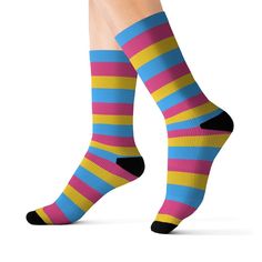 Pansexual | Pan Pride | Indie Clothing | Pride Socks | Bridesmaid Socks | Funny Socks | Fun Socks | Cute Socks | Pride Gift Box | Cool Socks | Designer Socks | Pansexual Cloth | Pansexual Flag | Pansexual Pride | Pansexual Stripe Fabric | Trans Pride | Pride Outfit | Progress Pride Flag |  Striped Socks These high quality socks with an all over pansexual flag print (pink, blue, and yellow) will provide optimum comfort with style wherever you go. It can be a subtle accent to complement your look or it can be look or an eye-catching statement for a bolder outfit.  Size Guide: Small -- women's sizes 6-8, men's sizes 5-6.5 Medium -- women's sizes 8.5-11, men's sizes 7-9.5 Large -- women's sizes 11.5-13, men's sizes 10-13 .: 60% Polyester 10% Acrylic 25% Nylon 5% Spandex .: 3 different sizes .: Bridesmaid Socks, Pride Socks, Pan Pride, Indie Clothing, Socks Funny, Pansexual Pride, Socks Cute, Fun Socks, Trans Pride