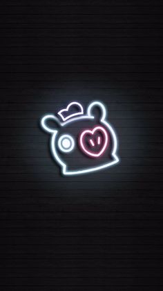 a neon sign that is on the side of a wall with a heart in it