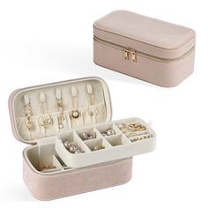 an open jewelry box with several compartments