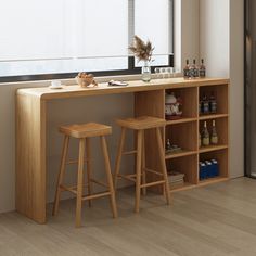 two wooden stools sitting next to a bar with bottles on it and a window in the background