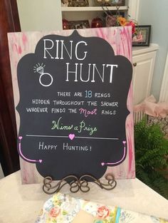 a sign that says ring and hunt on it next to some other items at a table