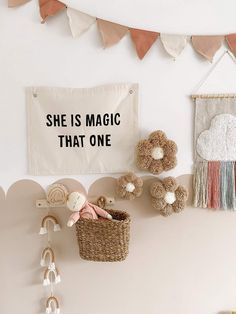 she is magic that one sign hanging on the wall next to other decorations and toys