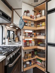 the inside of a kitchen with lots of shelves and food items in it's cupboards